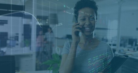 Talking woman in short-sleeve top holding clipboard and smartphone in office with charts overlay