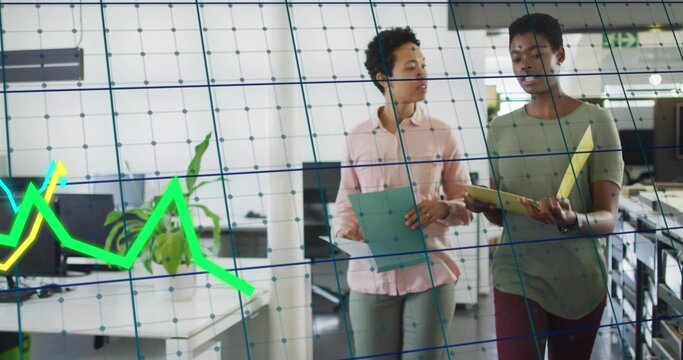 Walking coworkers with folders, talking in office via glass with neon chart and grid, businesswear