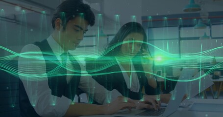 Working coworkers in suits typing on laptops, holding smartphone at office, green waveform overlay