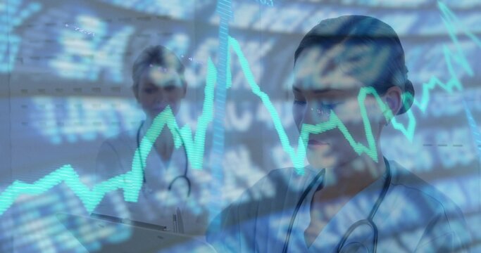 Checking clinician in scrubs leaning over pad in ward showing stethoscopes and data overlay