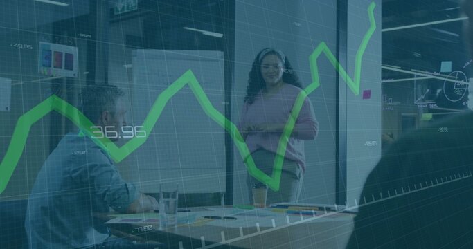 Presenting woman speaking in glass room with flip chart wearing light sweater showing green overlay - Powered by Adobe