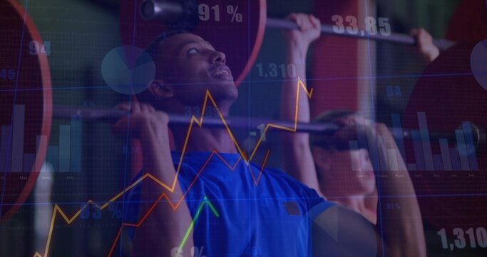 Pressing man wearing blue athletic tee holding loaded barbell in gym, with floating charts - Powered by Adobe