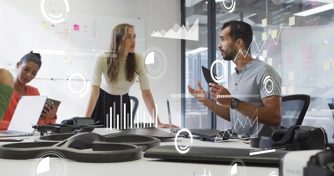 Presenting female presenter in light top and skirt, gesturing to colleague, office with drone parts - Powered by Adobe