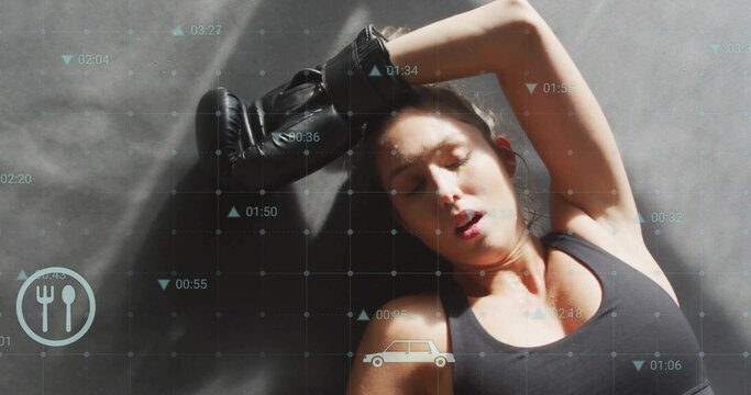 Lying woman resting on gym mat, wearing black bra and glove, grid showing fork-and-knife, car icons - Powered by Adobe