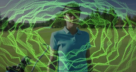 Standing golfer holding club beside golf bag wearing blue polo visor on fairway neon spiral overlay