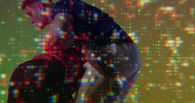 Grappling two men controlling torso and hips in studio, wearing t-shirts and shorts, pixel overlay - Powered by Adobe