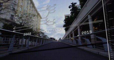 Fototapeta premium Walking pedestrians wearing coats ascending footbridge with metal rails HUD labels 2008 2015
