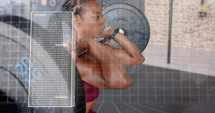 Lifting woman in burgundy sports bra holding loaded barbell at gym, showing binary overlay - Powered by Adobe