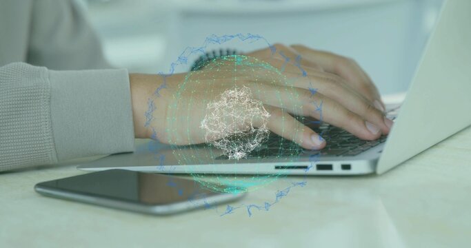 Typing hands wearing light top with wrist watch on home desk, silver laptop, phone, globe overlay