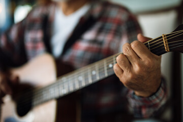 Guitar playing session indoors by a musician