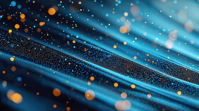 An abstract digital background featuring flowing blue waves and scattered golden and blue particles, with soft bokeh lights creating a sense of depth and moveme - Powered by Adobe