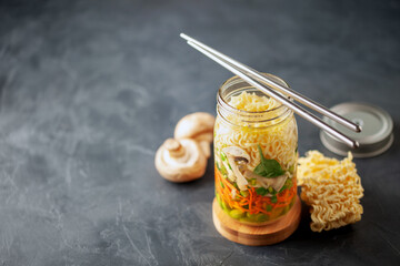 Healthy homemade instant noodles with vegetables in mason jar. Asian  vegetarian lunch idea. To-Go Miso Noodle Soup