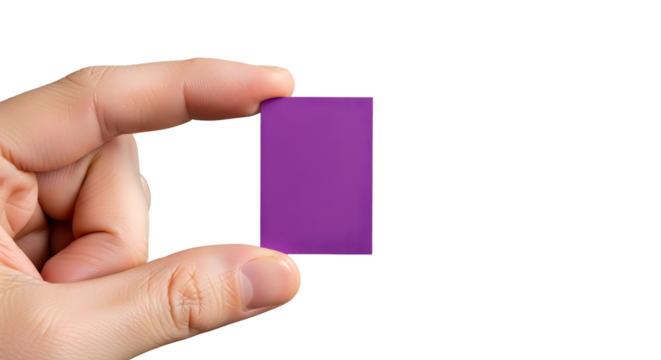 Human hand carefully holding a small, vibrant purple rectangular block against a clean white background, showcasing precision and a simple geometric form with potential
