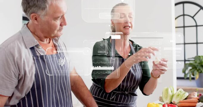Woman checking clove and showing while man watching tablet sending HUD chatbox aiding kitchen prep