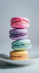 Stacked macarons on plate. Pastel, colorful, delicate dessert