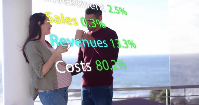 Expecting couple clinking mugs, man reaching and touching belly, finance terms overlaying scene
