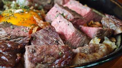 Beef fried rice topping with beef, parsley and pickled yolks.