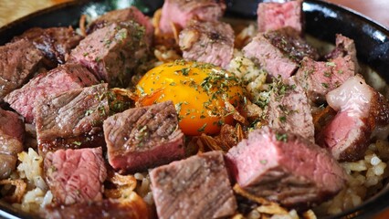 Beef fried rice topping with beef, parsley and pickled yolks.