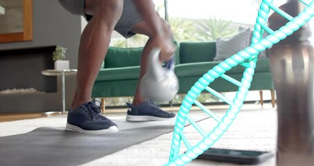 Man reaching, picking kettlebell, cycling swings, ending squat on mat for fitness, DNA helix, phone
