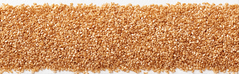 Fototapeta premium Symmetrical Arrangement of Sesame Seeds on White Background