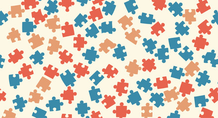 Engaging seamless pattern featuring scattered puzzle pieces in vibrant orange blue and red on a soft cream background.
