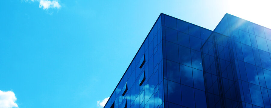 Galss Office Building Facade. Blue Buisness Background. City Architecture Contemporary