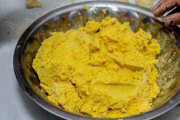 Freshly made dough in a stainless steel bowl, ready for cooking