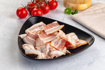Raw pork tenferloin with bacon