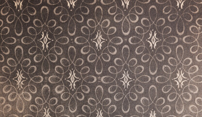 Old wallpaper on the wall. Old wallpaper for texture or background.