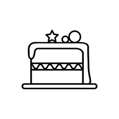 A cartoon cake with white frosting a star and two balls on top sits on a plate