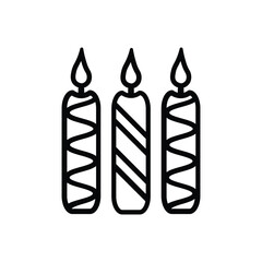 Three lit candles two striped with zigzags and one with diagonals stand sidebyside