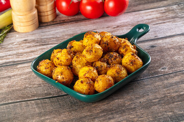 Baked small baby potato with herbs