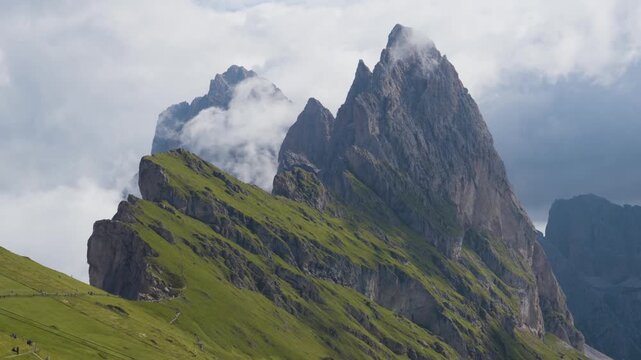 Seceda Ridge with Fog over Green Alpine Slopes in the Dolomites in Italy