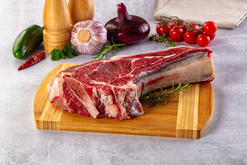 Raw prime beef steak with bone