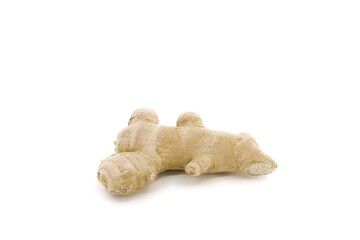 Whole ginger root captured on white studio backdrop.