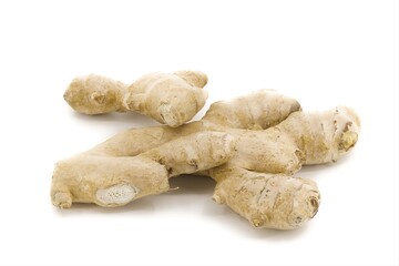 Ginger root arranged on bright white background.