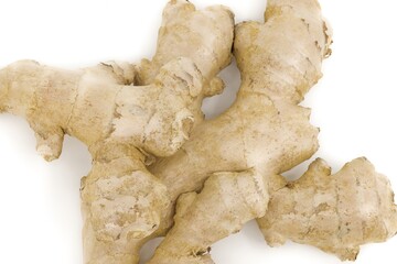 Ginger root presented on neutral white background.