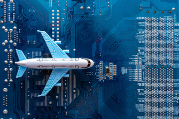 Toy plane on electronic computer circuit board hardware technology. Motherboard digital chip. Computer components. Top view. Copy space.