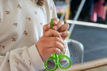 Child having fun with an authentic leisure activity, fine motor skills development