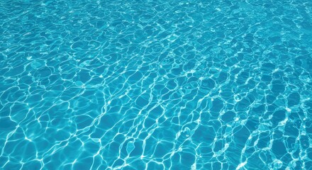 Obraz premium Crystal clear blue water reflecting bright summer sunshine on the rippling surface of an outdoor swimming pool, perfect for vacation relaxation ,coping ,blue ,sunny