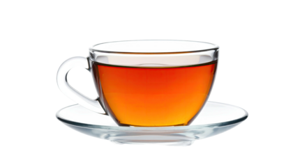 A clear glass teacup on saucer, filled with dark amber tea against black backdrop