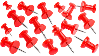 Group of scattered red pushpins, various angles, isolated on black background