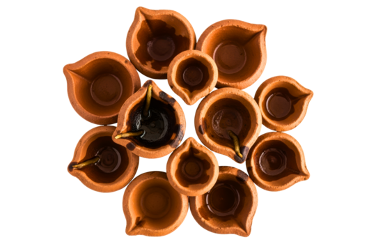 Circle of brown clay oil lamps isolated with transparent background