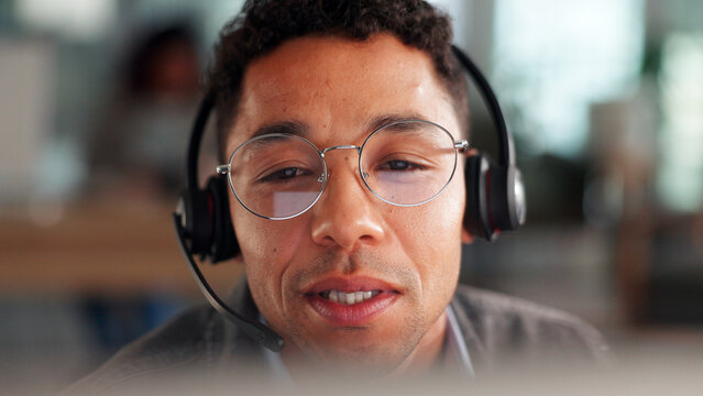 Man, headset and reading with computer in call centre for customer service, online query and billing. Agent, pc and consultation for payment information, audit advice and glasses with refund request