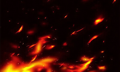 Glowing embers drift from a blazing fire on a dark background, scattering sparks around. Smoke rises in gentle waves through the orange glow. The moment conveys heat, motion and fiery energy.