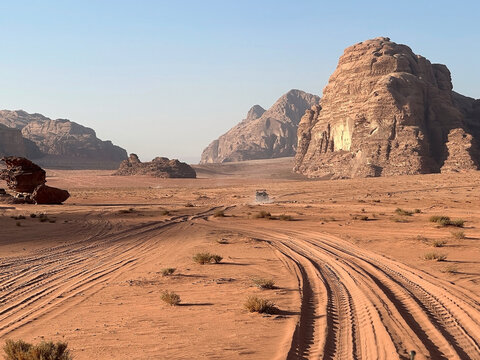 0ff-road vehicle with tourists along the track in the Wadi Rum desert, Jordan