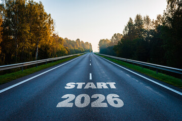New year 2026 start or goal concept. Text 2026, written on the road in the middle of asphalt road...