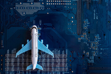 Toy plane on electronic computer circuit board hardware technology. Motherboard digital chip. Computer components. Top view. Copy space.