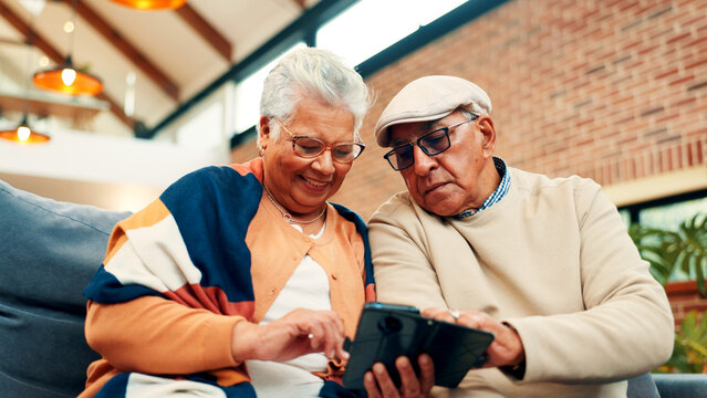 Sofa, happy and senior couple with phone for online connection, internet and networking. Retirement home, low angle and old man and woman on smartphone for website, bonding and relax together - Powered by Adobe