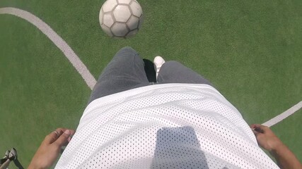 Football player skillfully dribbling ball on green turf, showcasing dynamic footwork and control, as the scene captures the fluid motion of the game in a vibrant outdoor setting - Powered by Adobe